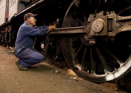 Powerhouse volunteer fixing train wheel